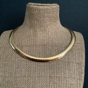 Gold tone omega necklace.